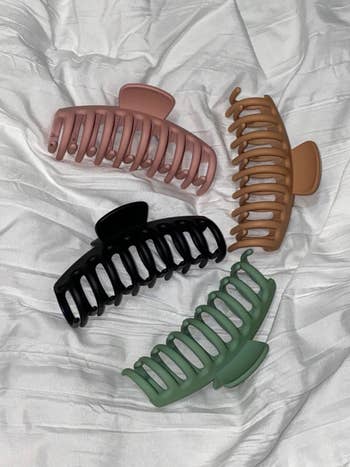 matte pink, brown, green, and black large claw clips