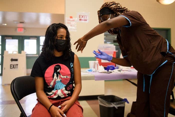 woman getting her COVID vaccine