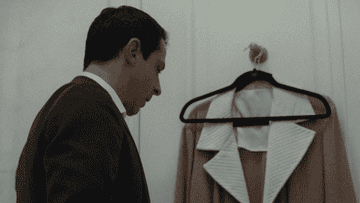 Jeremy Strong as Kendall screaming into a suit jacket