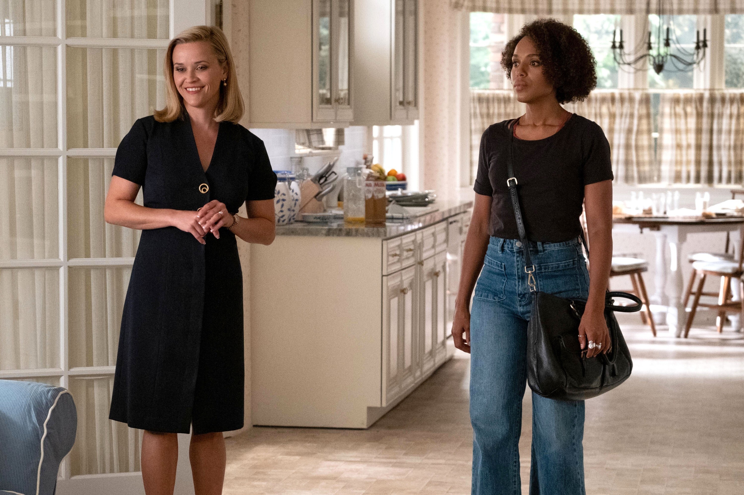 Reese Witherspoon and Kerry Washington stand in a kitchen