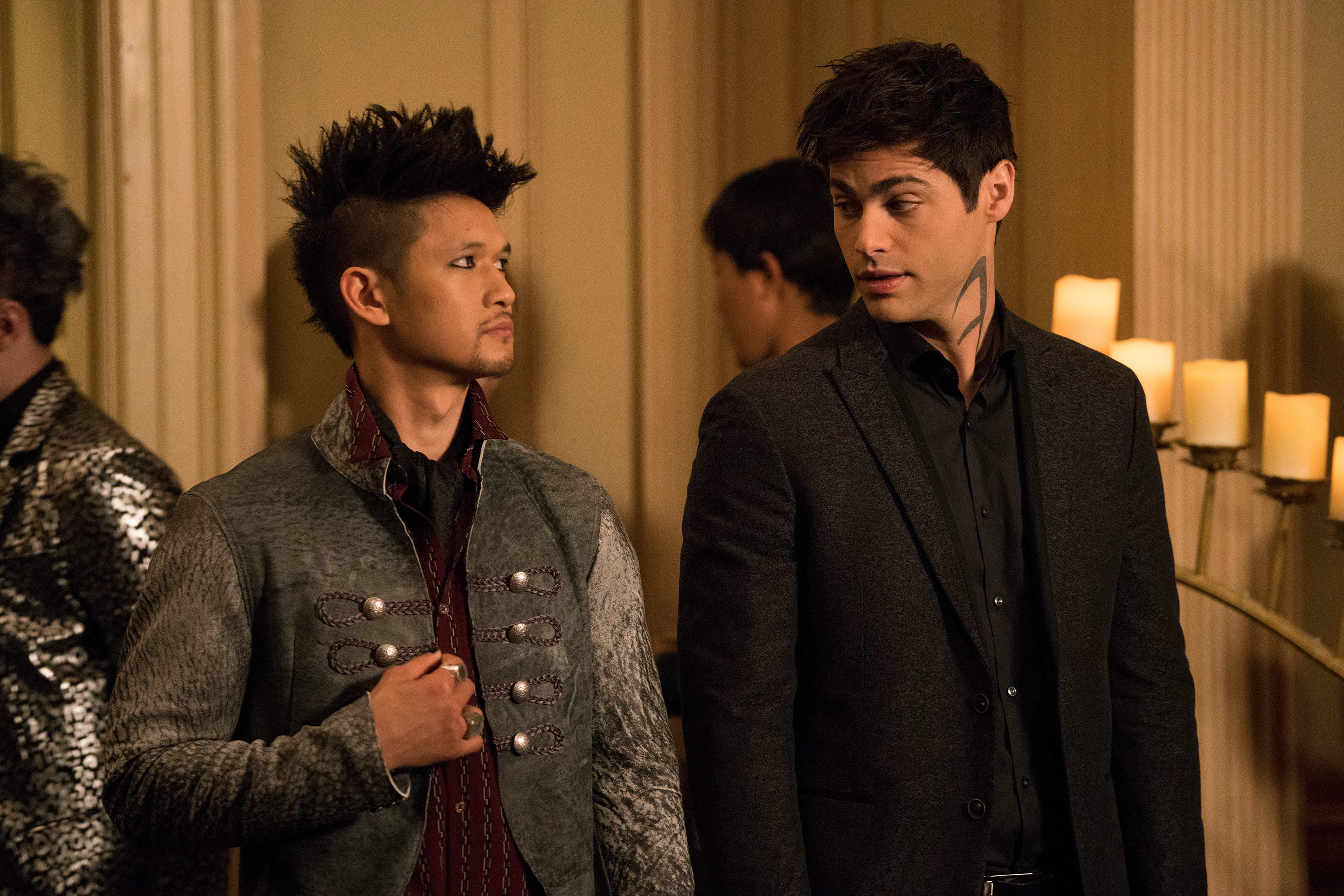 Harry Shum Jr. and Matthew Daddario look at each other