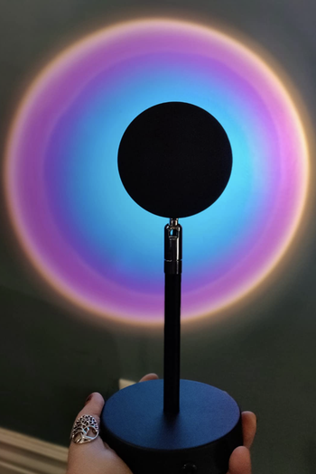 Reviewer's lamp shows purple and blue light on the wall