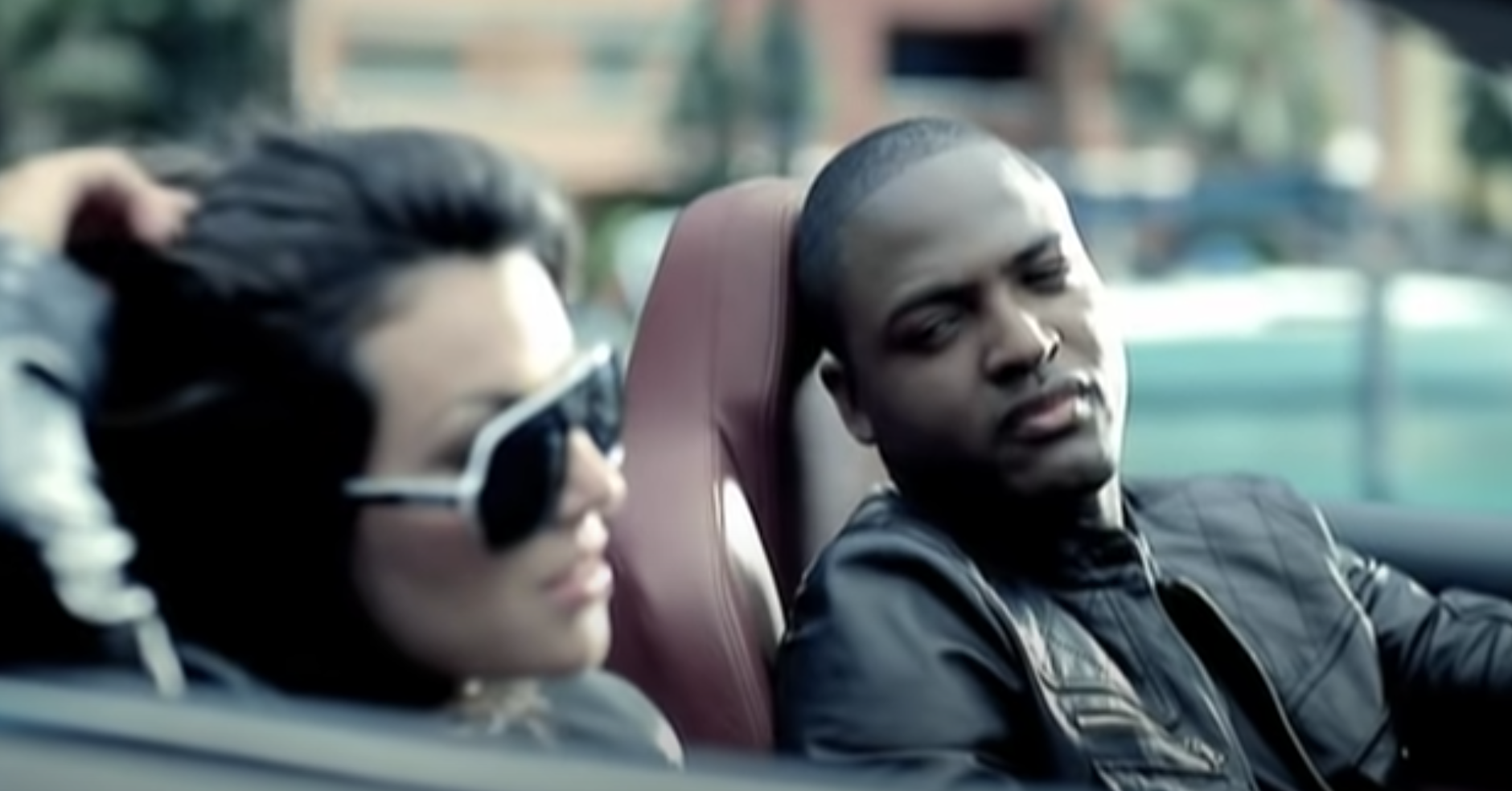 Taio Cruz looks at his love interest in the video for "Break Your Heart"