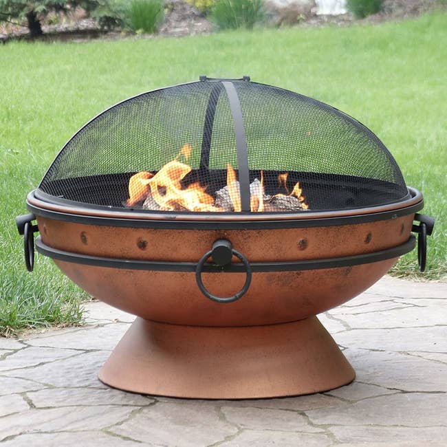 Copper fire pit bowl with four handles and spark screen