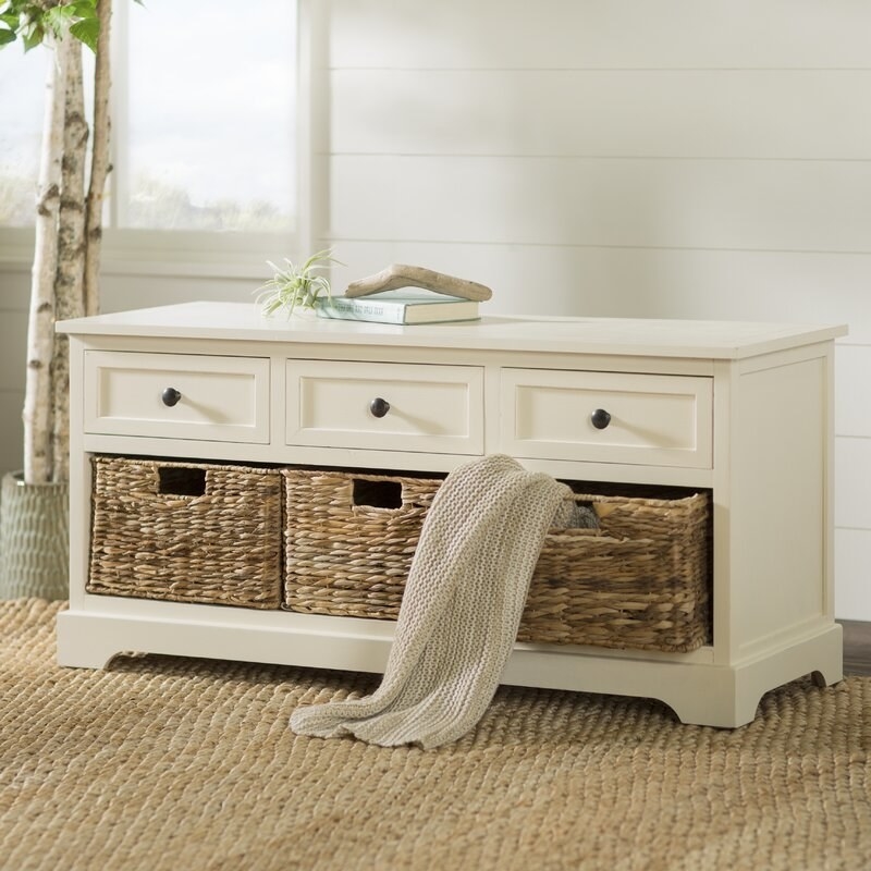 the storage bench in cream with wicker baskets