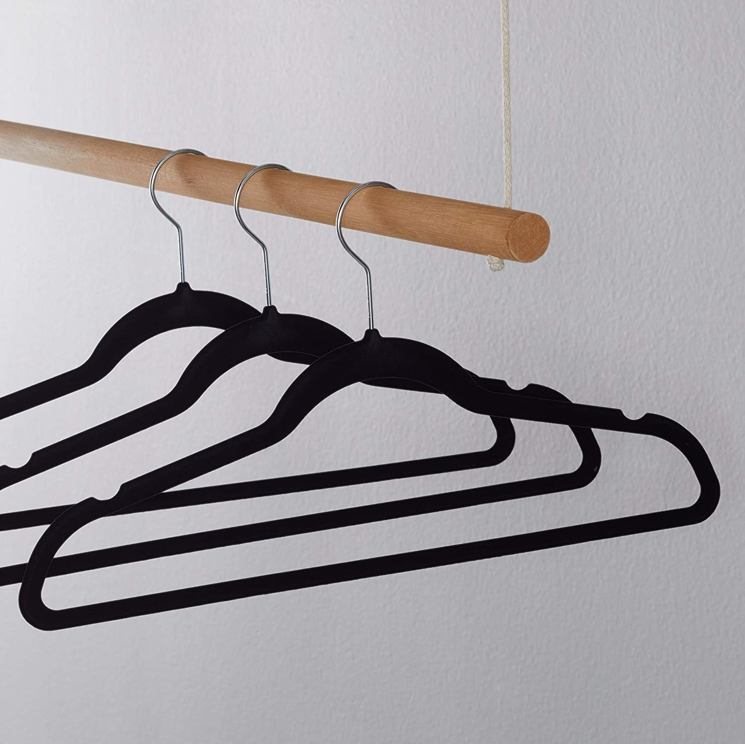 Three hangers on a wooden rod