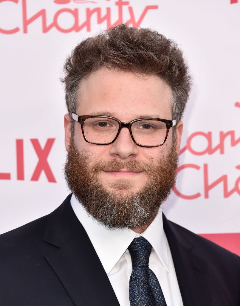 Close-up of Seth on the red carpet and wearing a suit and tie