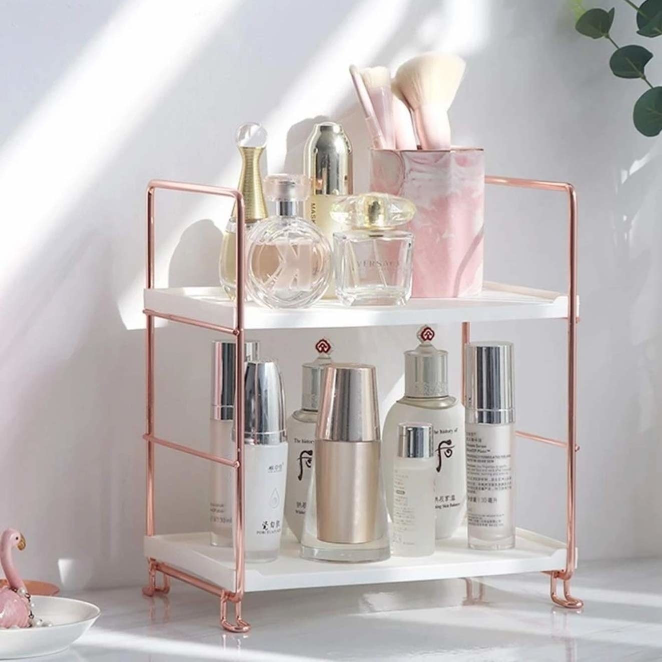 The two-tier rack with a white base and rose gold sides.