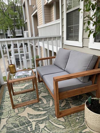 side view of the loveseat on a different reviewer's balcony