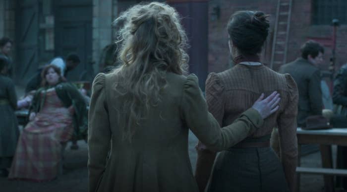 Back of Penance and Amalia; Penance with hand on Amalia's back