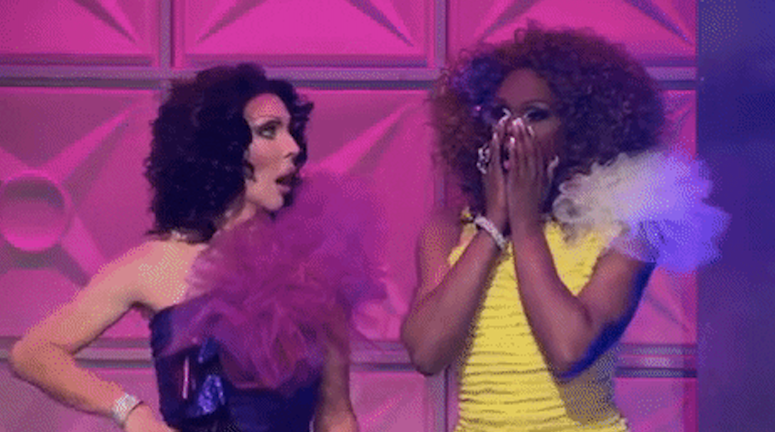 Drag queens covering their mouths and reacting with shock