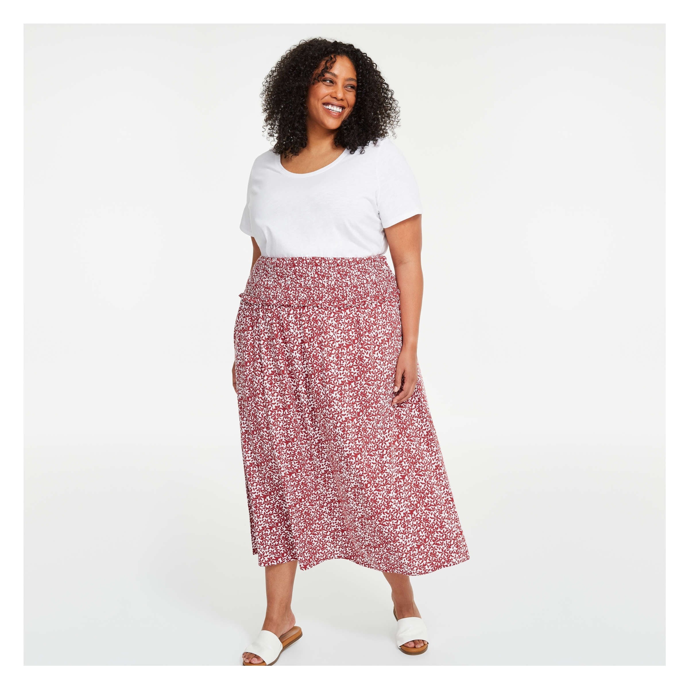 a person wearing a long floral skirt
