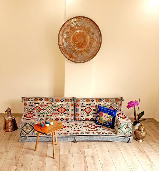 Turkish floor couch on wooden floor next to table