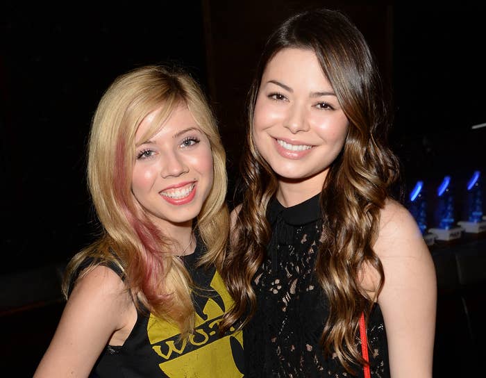 Miranda and Jennette smile while standing close together