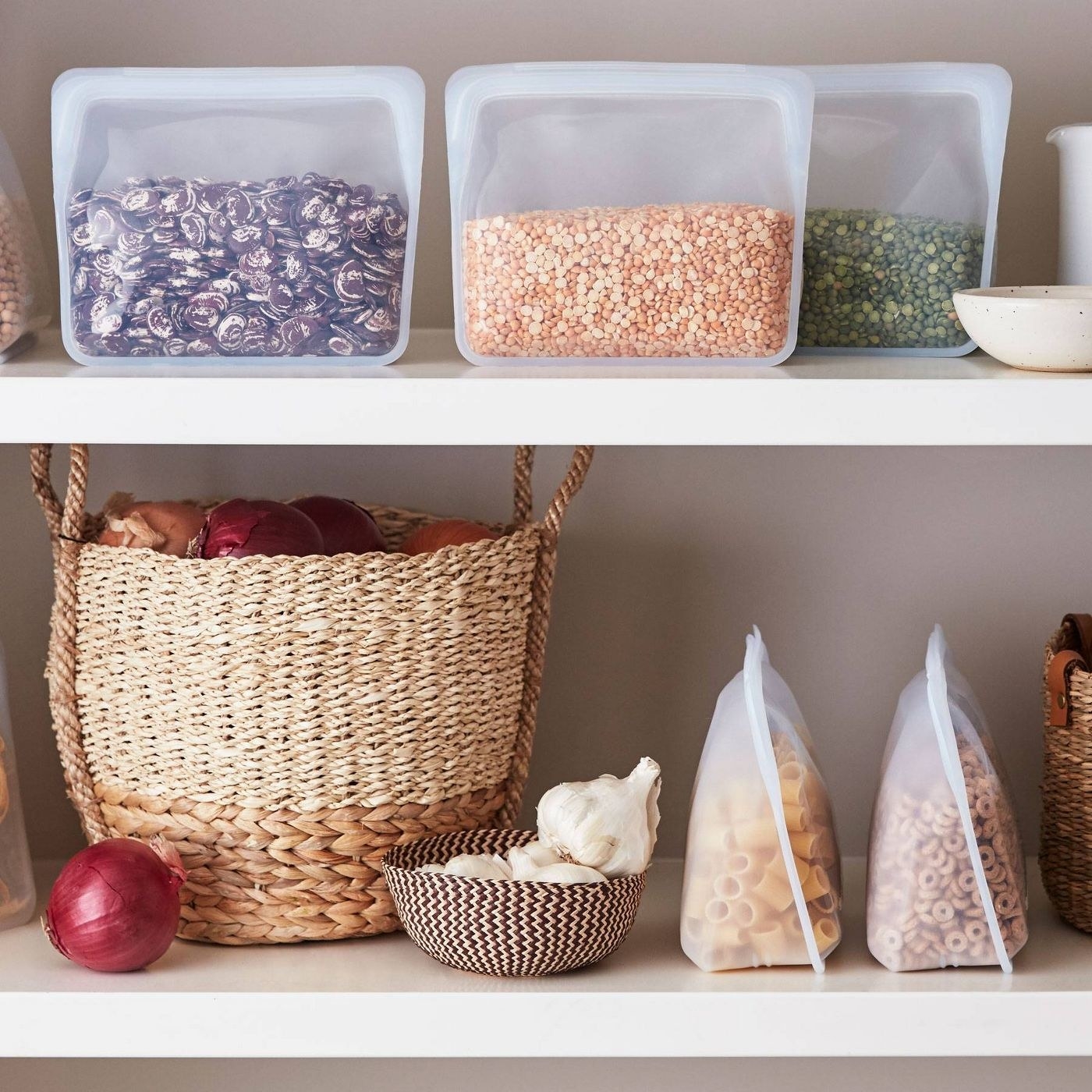 The bags in a pantry with food in them