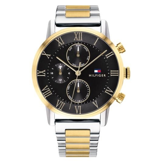 a silver and gold tommy hilfiger watch with a black face and roman numerals