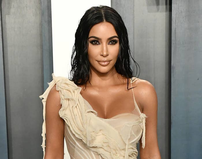 Kim wears a one-shoulder dress to an event 