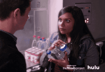 Mindy dropping a half a dozen water bottles in shock
