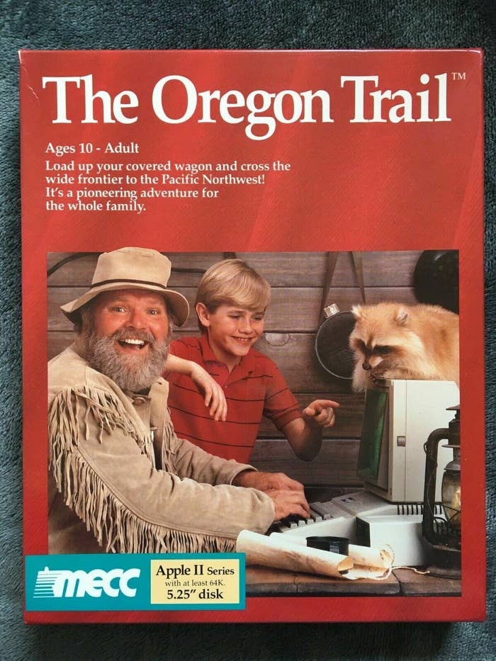 A box for one of the early versions of &quot;The Oregon Trail,&quot; complete with a mountain man using an Apple II computer with a raccoon on top of it