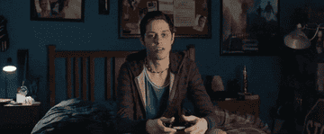 Pete Davidson playing video games in bed
