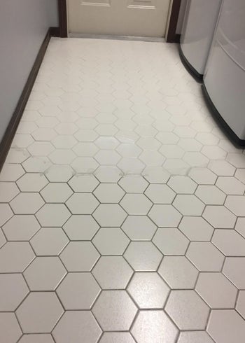 A reviewer's half clean half dirty tile floor