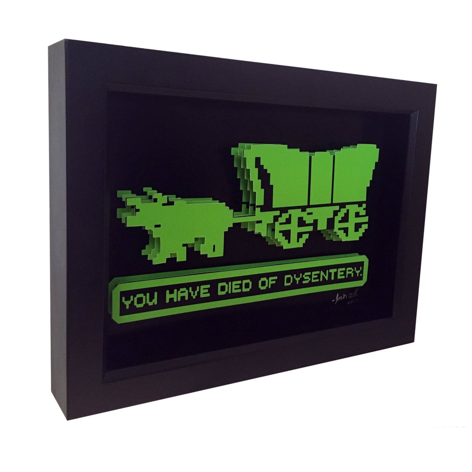 A framed picture of an 8-bit covered wagon that says &quot;you have died of dysentery&quot;