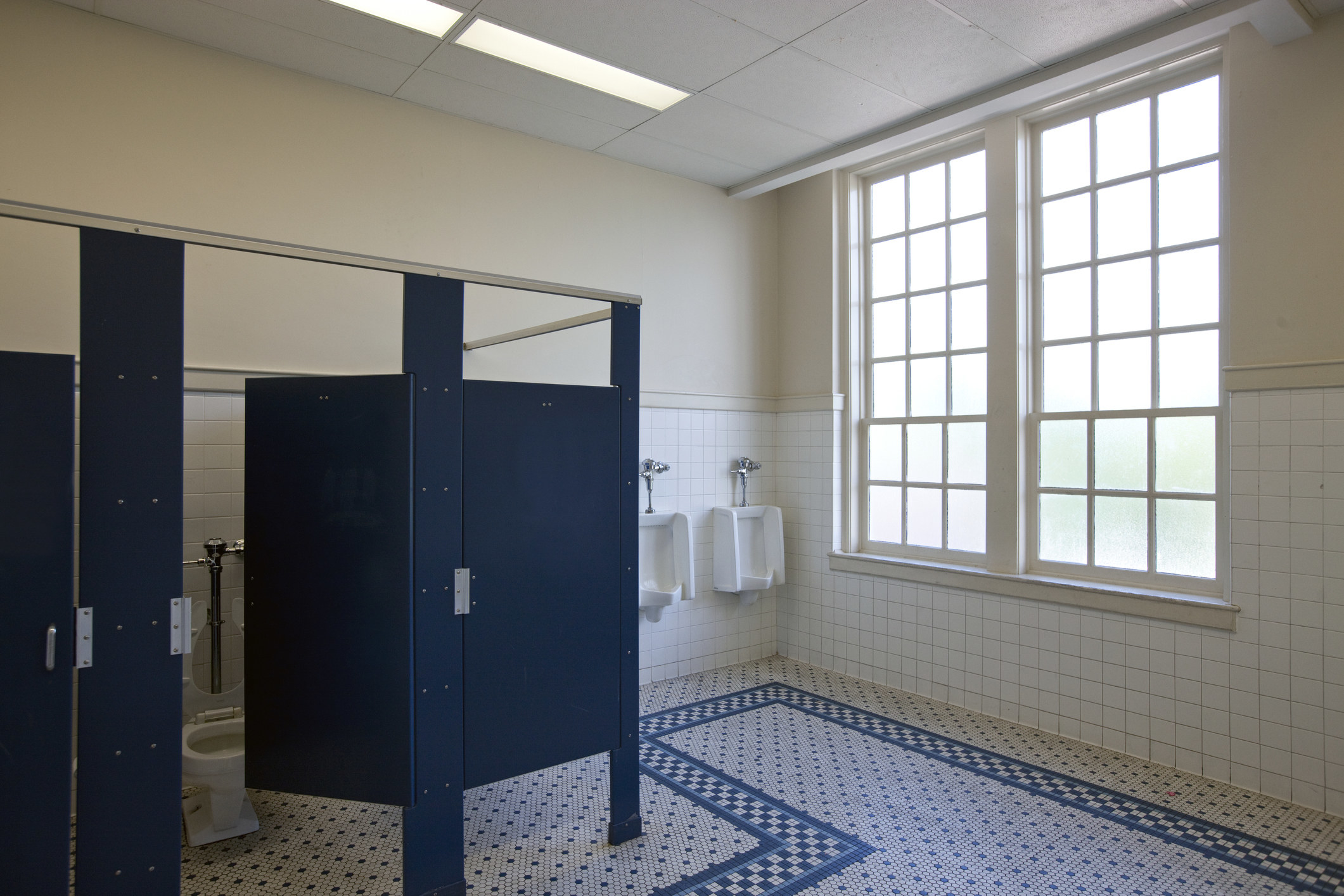 Men&#x27;s bathroom in a school stock image