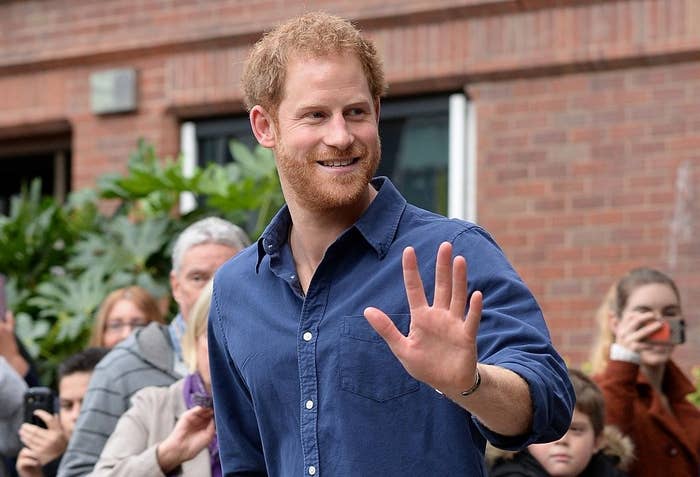 Prince Harry waves as he leaves Nottingham's new Central Police Station