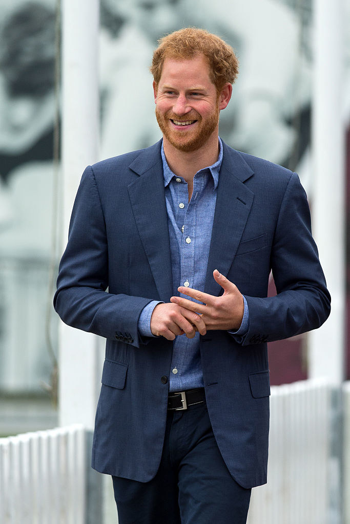 Prince Harry takes part in a training session during a celebration for the expansion of Coach Core