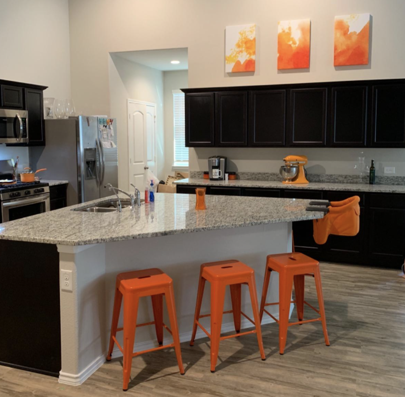 Reviewer&#x27;s kitchen with orange barstools