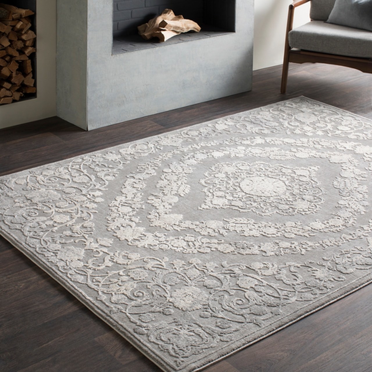 The grey carpet with embossed white floral medallion patterning