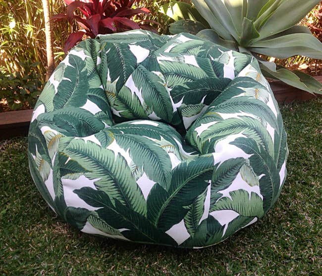 the bean bag with a green leaf pattern