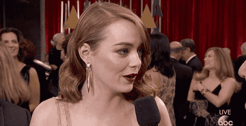 Emma Stone at the 2017 Academy Awards, shrugging