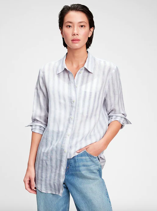 A person wearing the linen shirt over a pair of jeans