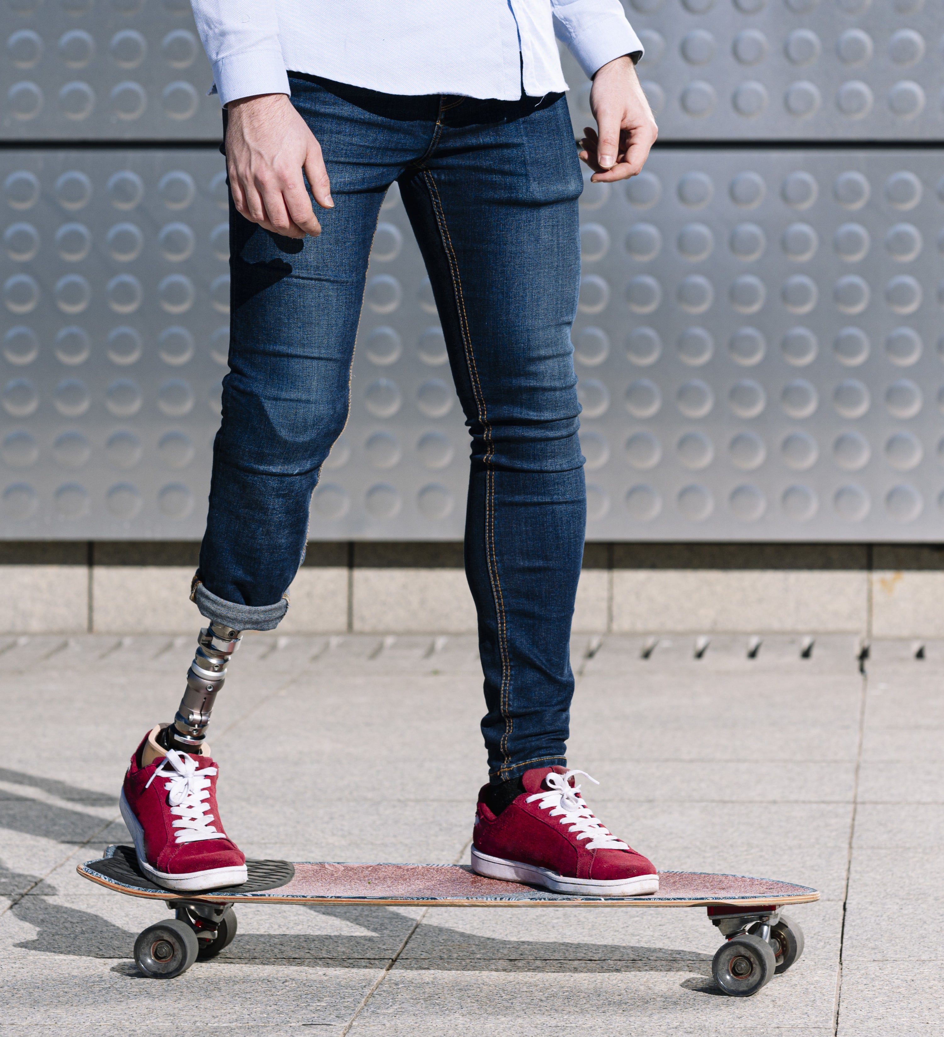 A person with a prosthetic leg skateboarding