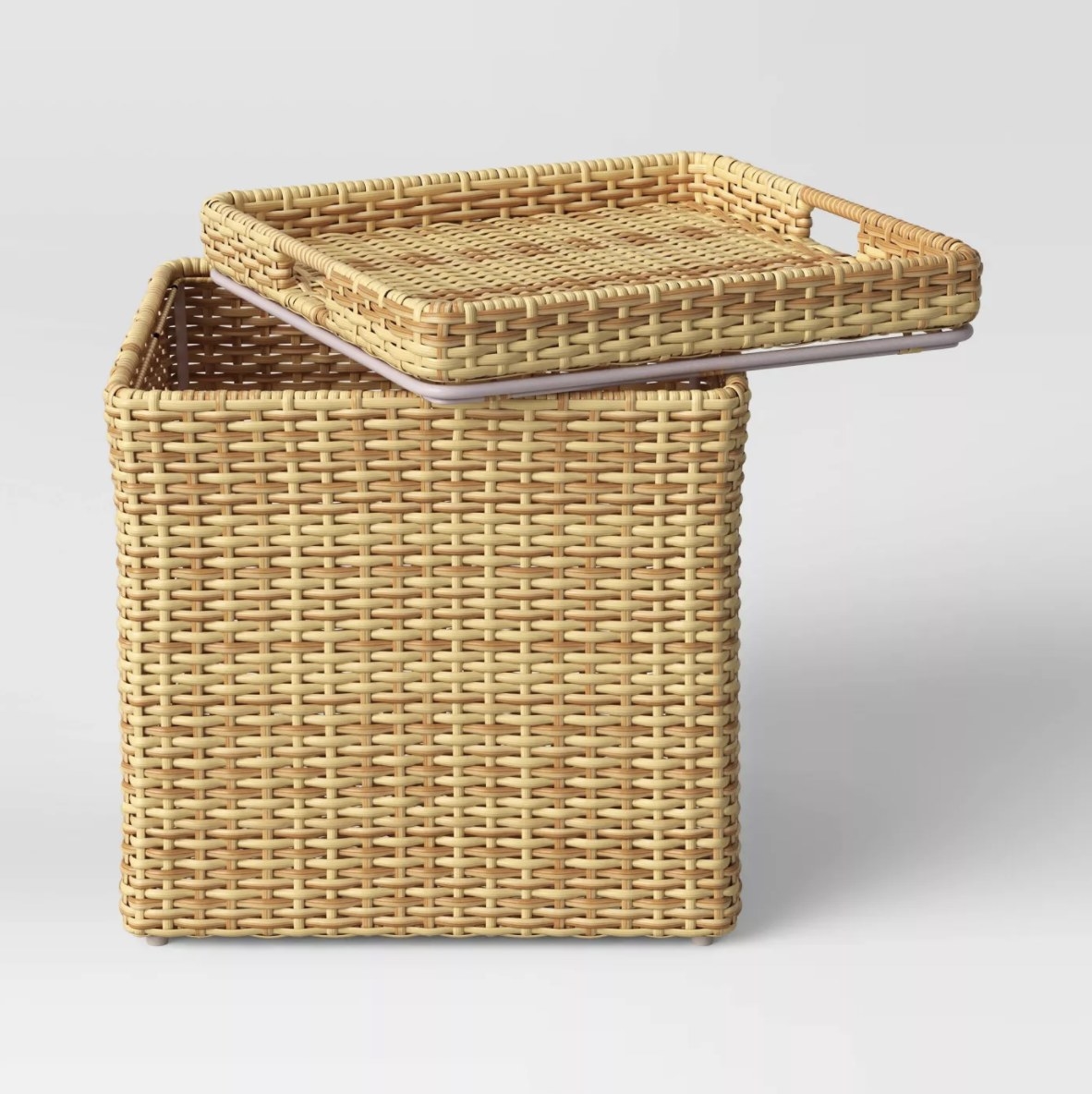 The light yellow-brown wicker table has a light pink seal on the bottom of the lid