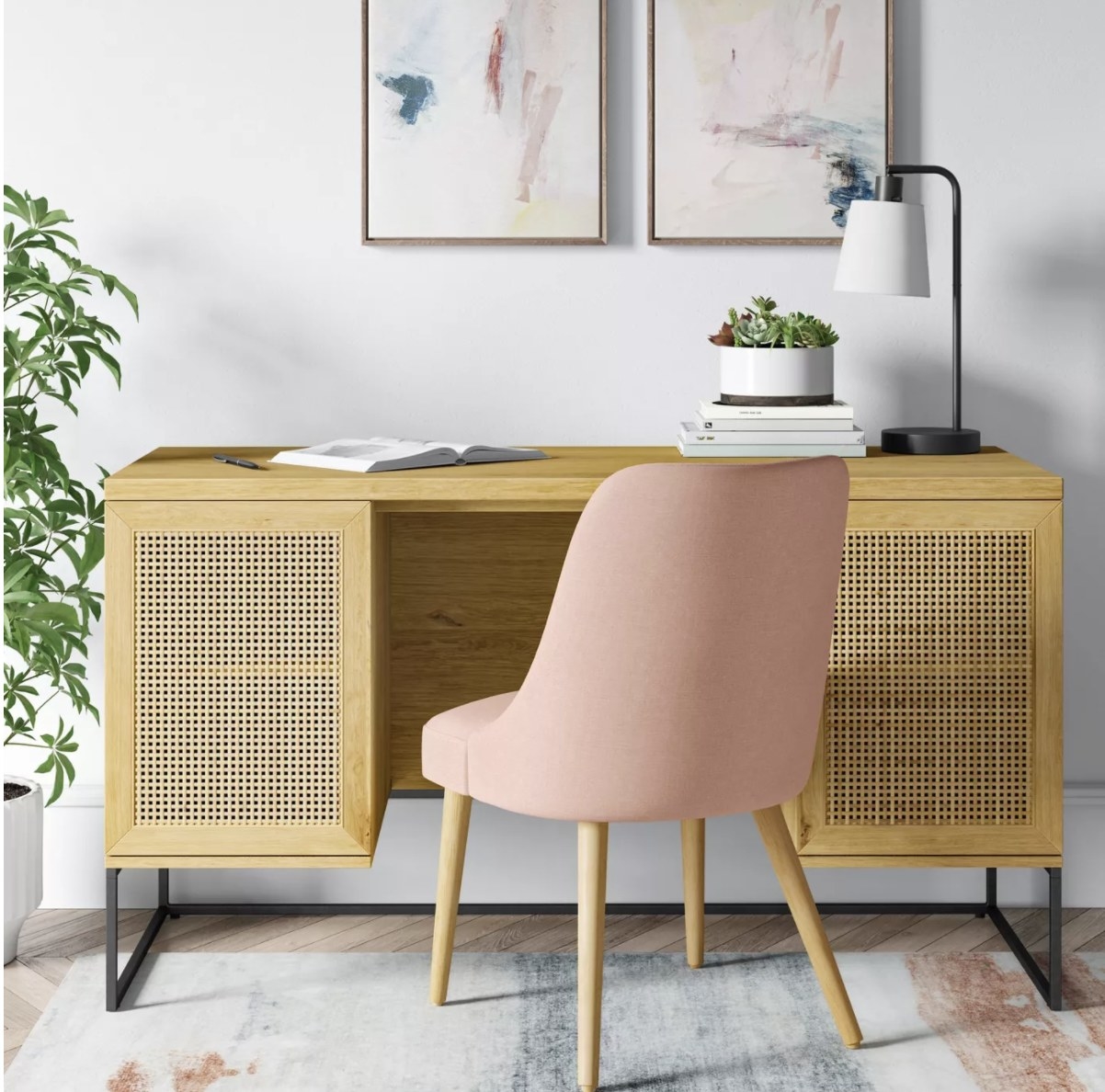 The desk has a flat top with large drawers that have a light yellow lattice design 