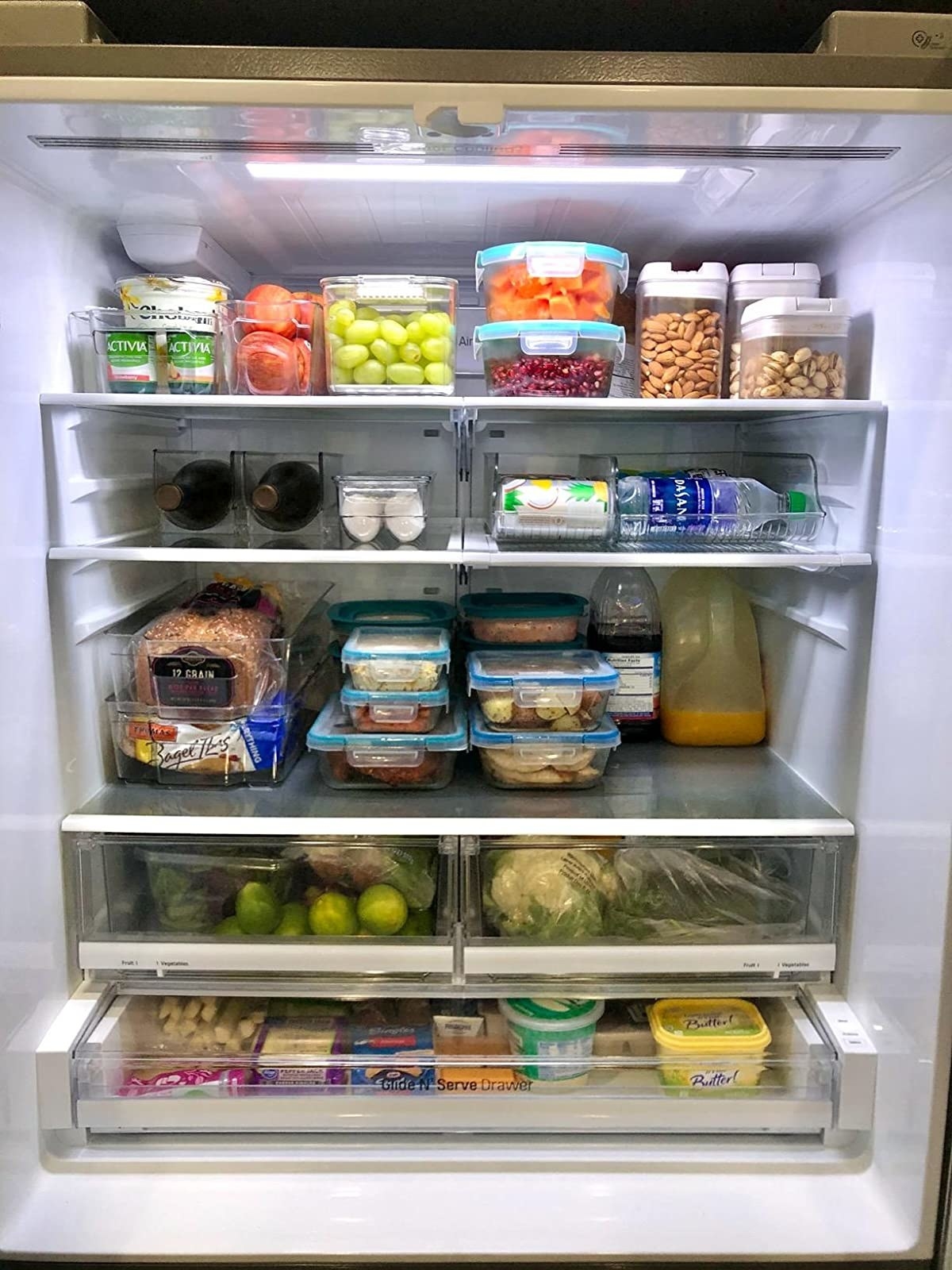 a reviewer&#x27;s image of the food storage bins in their fridge