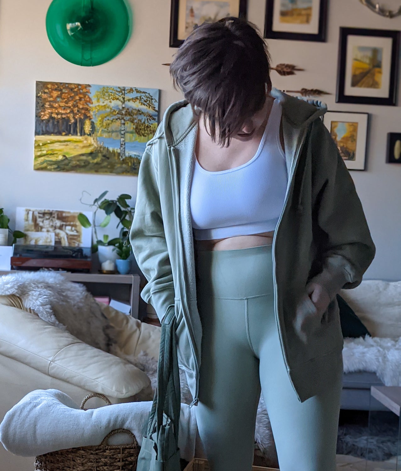 Victoria wearing the oversized hoodie with a matching pair of leggings
