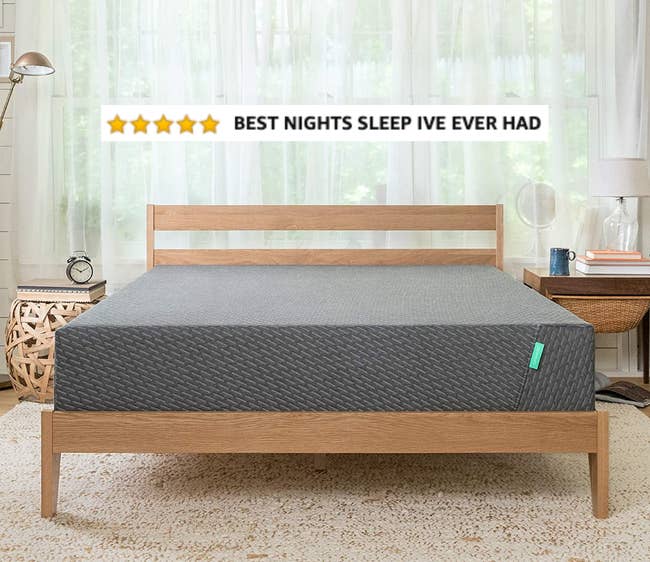 the mattress on a wooden bed frame with a screenshot of five stars and text on it that says 