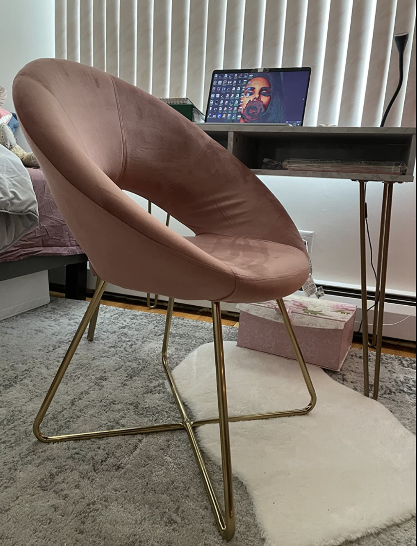 Reviewer&#x27;s pink velvet chair for their desk