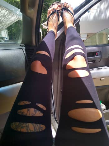 reviewer photo of legs showing the ripped fabric on leg area