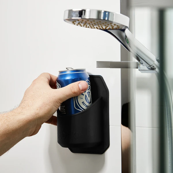 Model&#x27;s hand grabbing beer can from black shower drink caddy