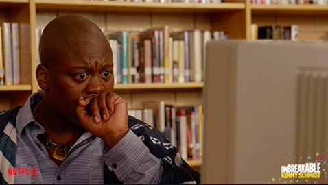 Titus from &quot;Unbreakable Kimmy Schmidt&quot; looking shocked at a computer