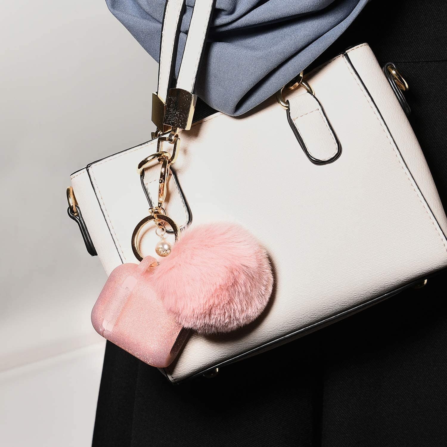 the keychain and pompom on a bag