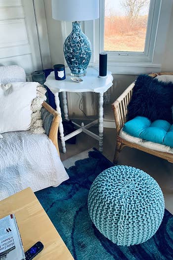 blue ottoman styled inside someone's home 