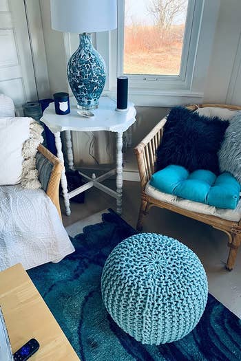 blue ottoman styled inside someone's home 