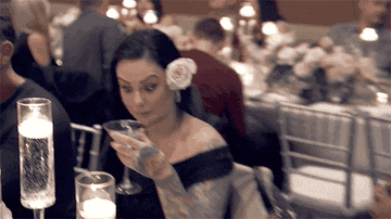 Jwoww from &quot;Jersey Shore&quot; looking shocked while sipping out of her glass