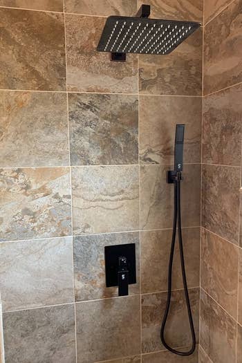 reviewer's rainfall shower in their bathroom 