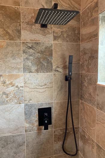 reviewer's rainfall shower in their bathroom 
